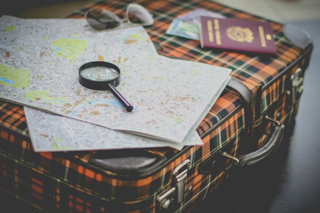 A map and passport on a vintage suitcase
